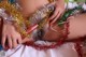 A woman laying on top of a bed covered in tinsel.