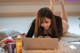 A woman laying on the floor using a laptop computer.
